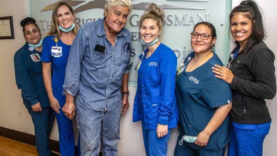 Jay Leno poses with medical staff at the Grossman Burn Center, where he received treatment