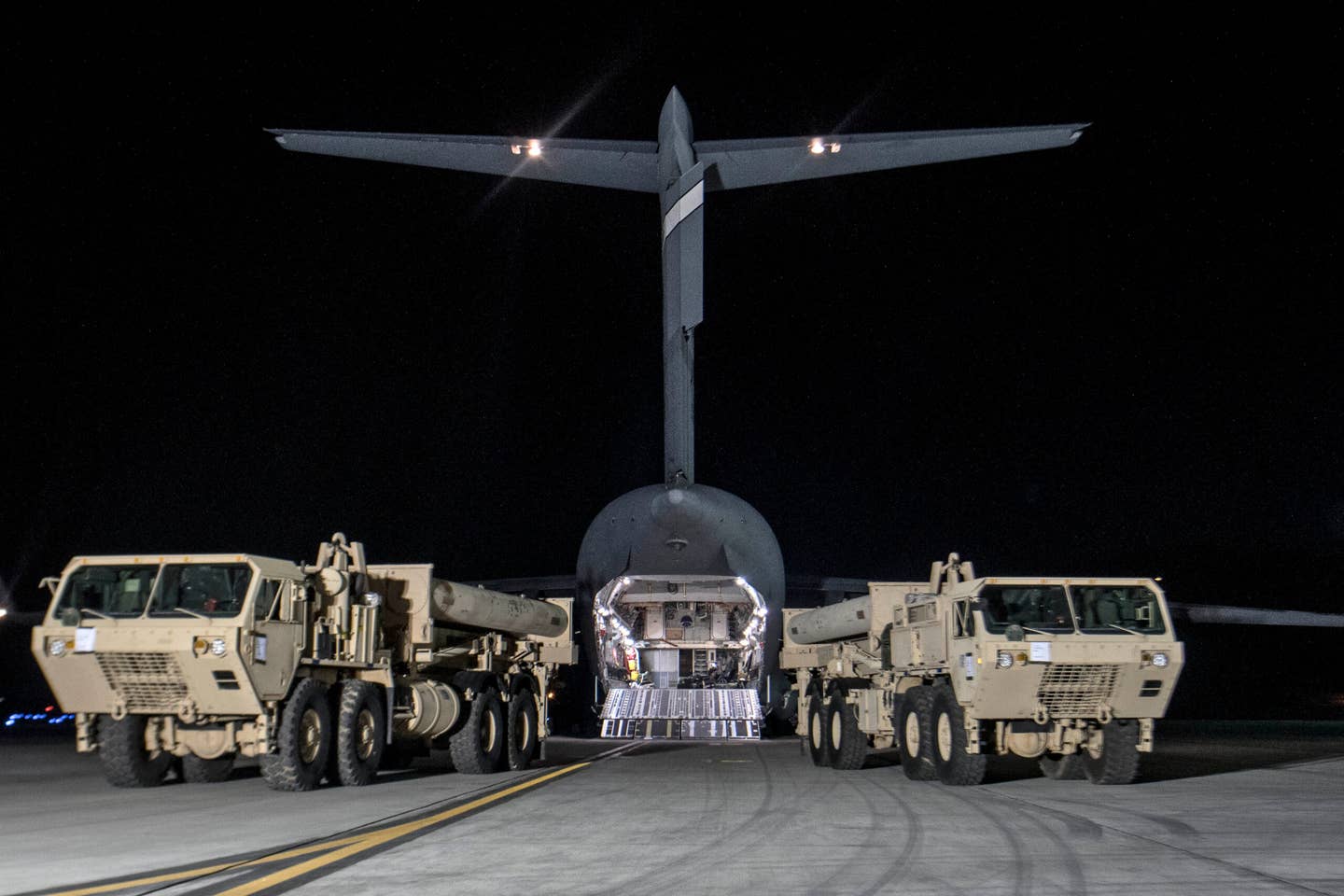 A truck carrying parts of U.S. missile launchers and other equipment needed to set up the Terminal High Altitude Area Defense (THAAD) missile defense system arrive at Osan Air Base, South Korea. <em>Getty Images</em>