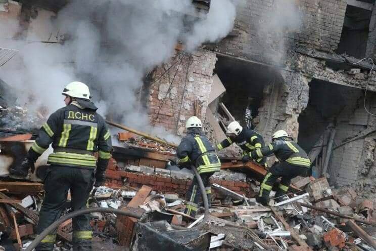 Firefighters work to put out a fire after Russian rockets hit residential areas in Ukraineâs capital Kyiv on Nov. 23, 2022. At least six were killed and 36 others injured in the attacks. (Photo by Ukrainian State Emergency Service/Anadolu Agency via Getty Images)