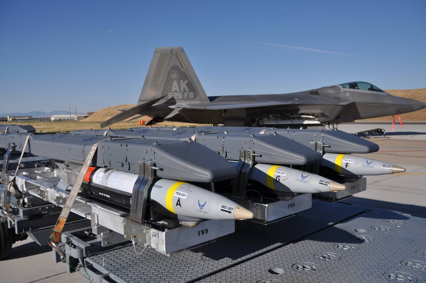 GBU-39 Small Diameter Bombs await loading on an F-22 Raptor during a Combat Hammer weapons system evaluation. <em>U.S. Air Force Photo/Tech. Sgt. Dana Rosso</em>