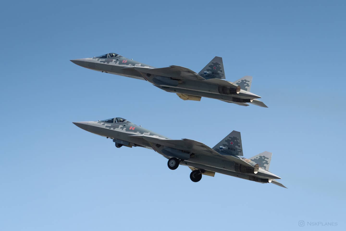 A pair of Su-57s depart Novosibirsk, on their way to Lipetsk, in May 2022. <em>NSKPlanes</em>