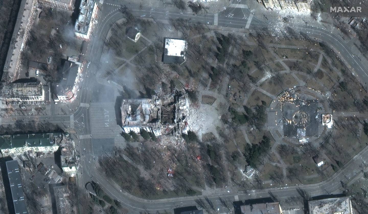 Maxar satellite imagery shows the Mariupol Theater in March. <em>Maxar</em>