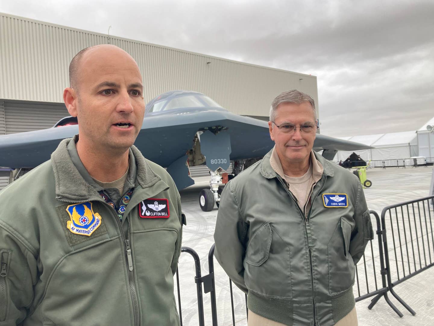 Air Force Lt. Col. Clifton Bell (l) and Northrop Grumman test pilot Chris Moss, scheduled to be the first to fly the B-21 Raider, talked about the mission at Northrop Grumman's Plant 42 in Palmdale, California hours before the unveiling of the Raider. (Howard Altman, The War Zone photo)