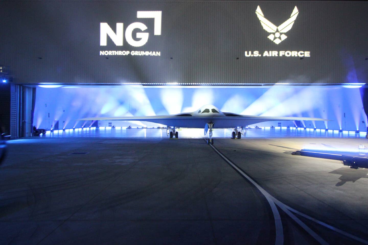 The B-21 Raider, anticipated to have its first flight next year, unveiled Friday at Northrop Grumman Plant 42 in Palmdale, California. (Howard Altman/<em>The War Zone</em> photo)