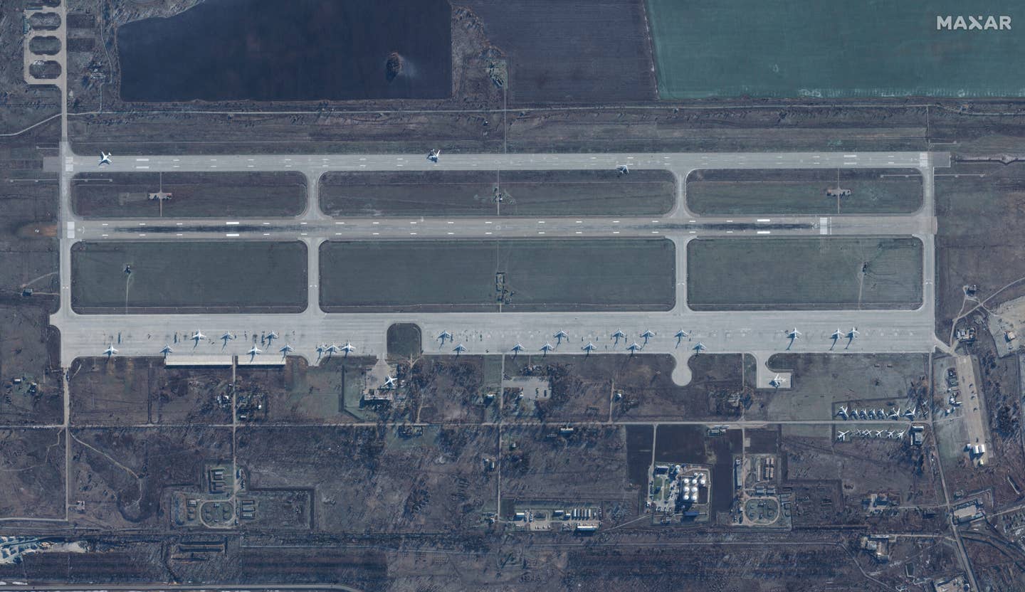 An overview of Engels Air Base in a satellite image from December 4, 2022, the day before the attack, with Tu-95MS, Tu-160, and Il-78 aircraft on the flight line. <em>Imagery by Maxar Technologies</em>