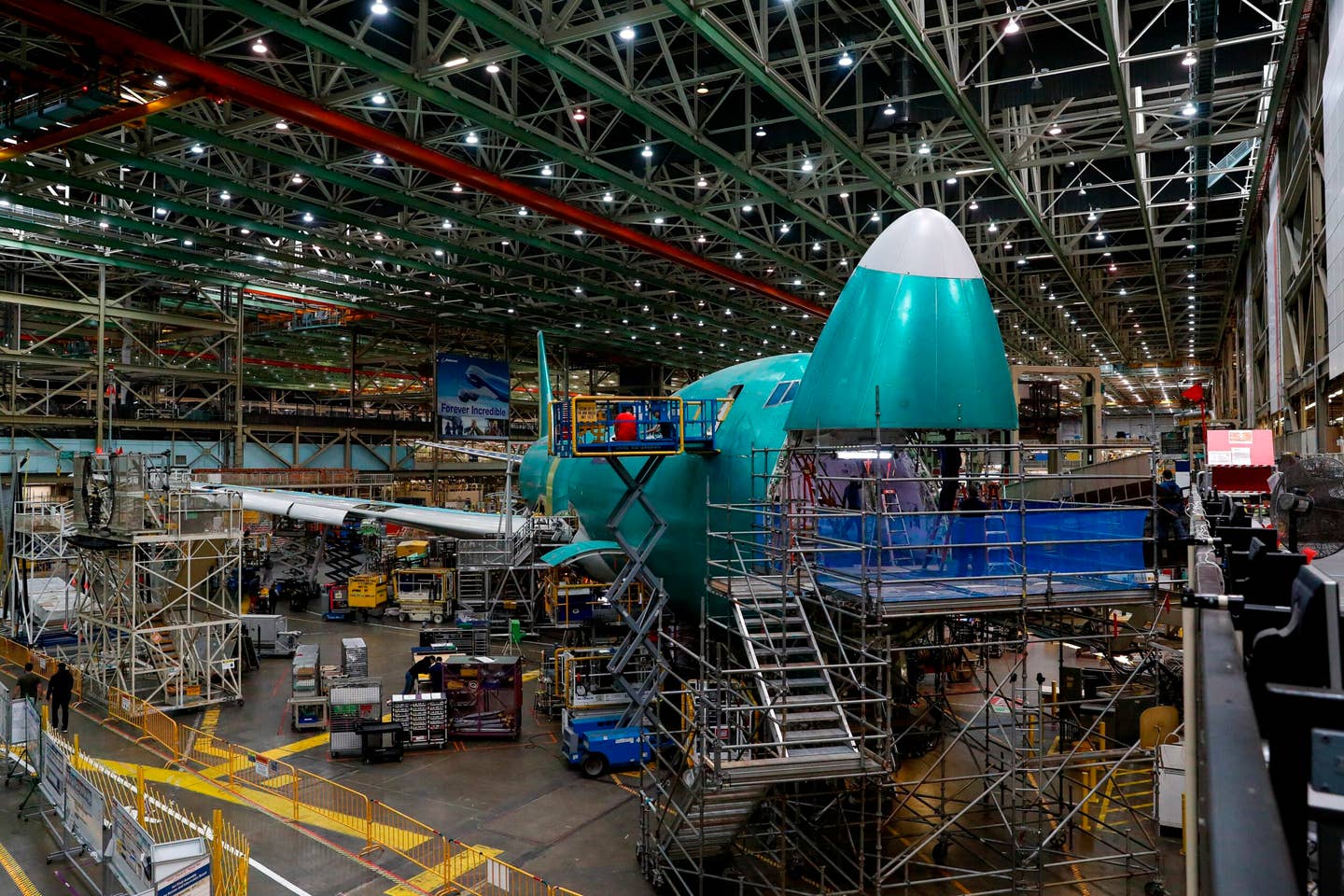 Workers assemble the third to last Boeing 747 aircraft at Boeing's Everett Production Facility Wednesday, June 15, 2022 in Everett, Wash. (Jennifer Buchanan/The Seattle Times via AP, Pool)