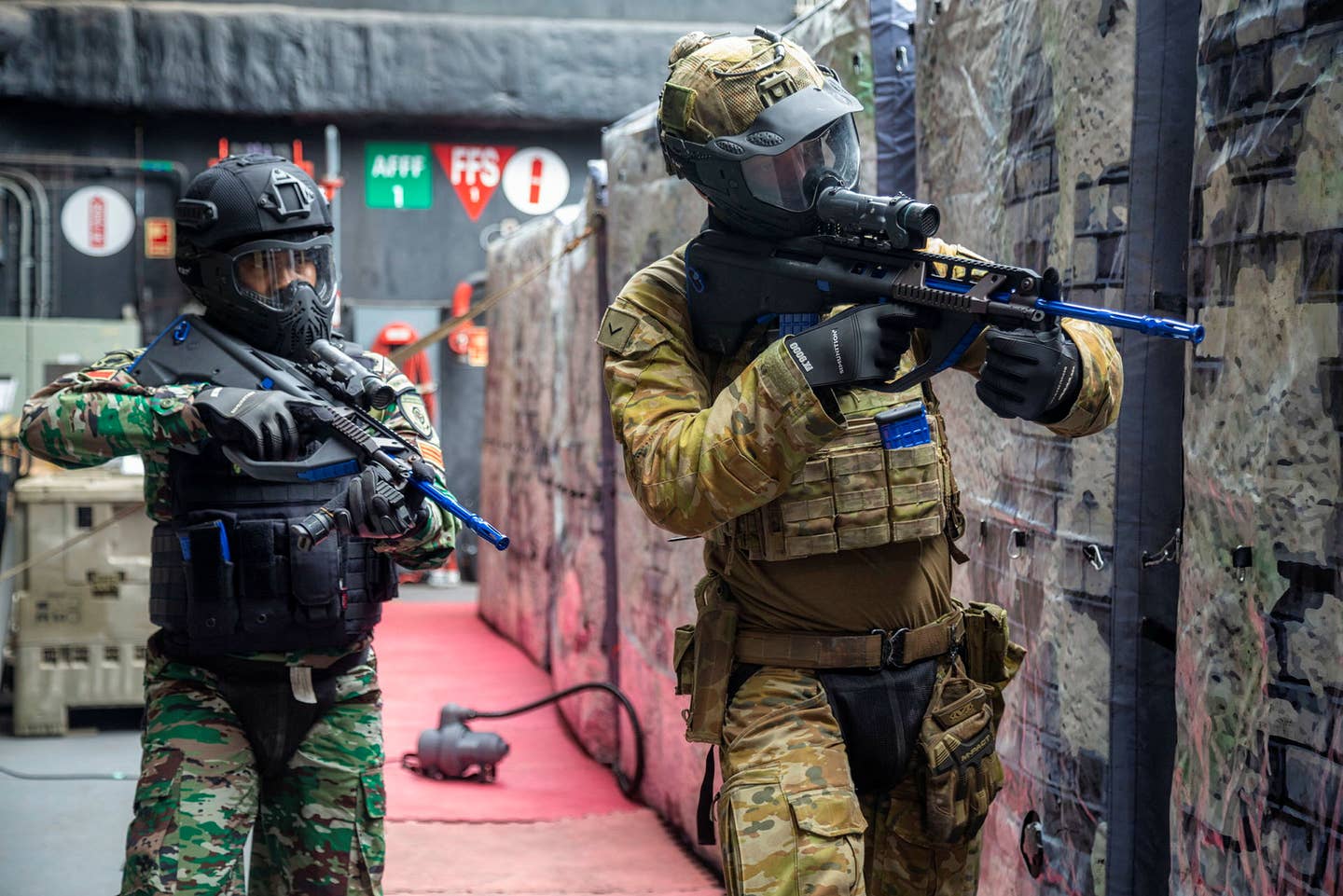 Two soldiers enter the shoot house. <em>Australian Department of Defense.</em>