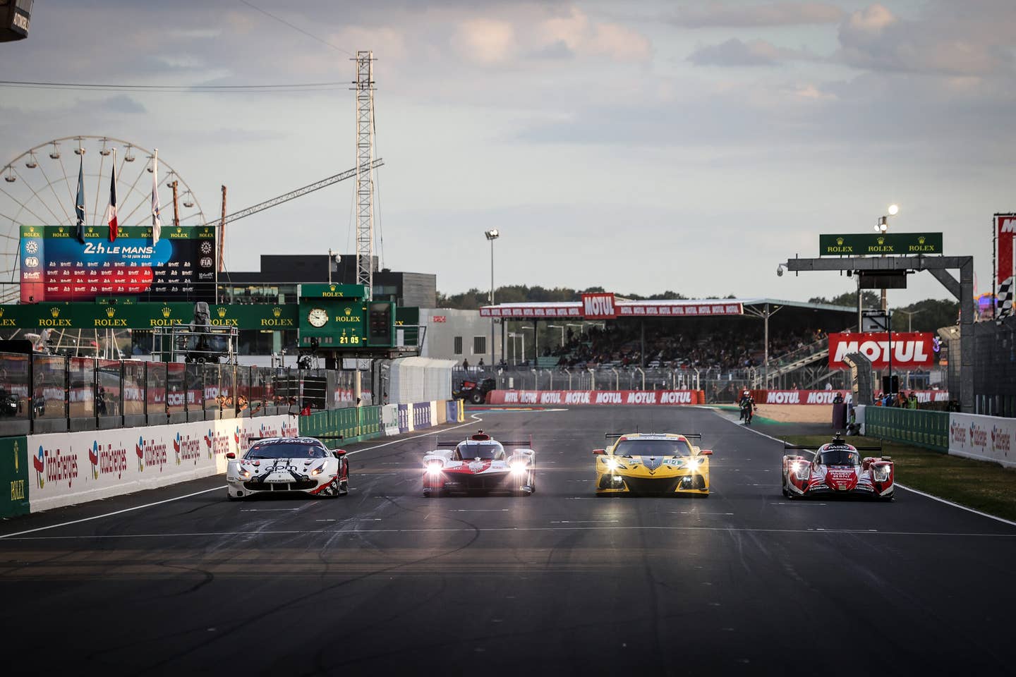 LE MANS, FRANCE - JUNE 9: Hyperpole winners (L to R): Vincent Abril of France and #61 AF Corse Ferrari 488 GTE Evo - LM GTE AM; Brendon Hartley of New Zealand and #08 Toyota Racing, Toyota GR010, Hybrid - Hypercar; Nick Tandy of Great Britain and #64 Corvette Racing - Chevrolet Corvette C8.R - LM GTE Pro; Robin Frijns of The Netherlands and #31 WRT Oreca 07 - Gibson - LMP2, at Le Mans 24 Hours practice and qualifying on June 9, 2022 in Le Mans, France. (Photo by James Moy Photography/Getty Images)