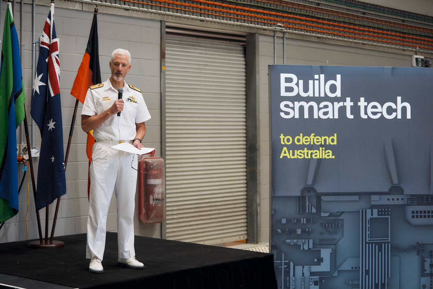 RAN Rear Adm. Peter Quinn speaking at the Ghost Shark prototype and naming ceremony Monday. <em>Credit: Anduril Australia </em>