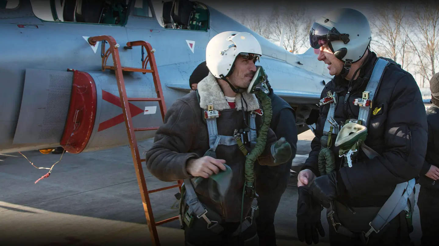 An image from the TFASA website apparently showing Western aircrew in front of an FTC-2000 jet trainer.&nbsp;<em>TFASA</em>