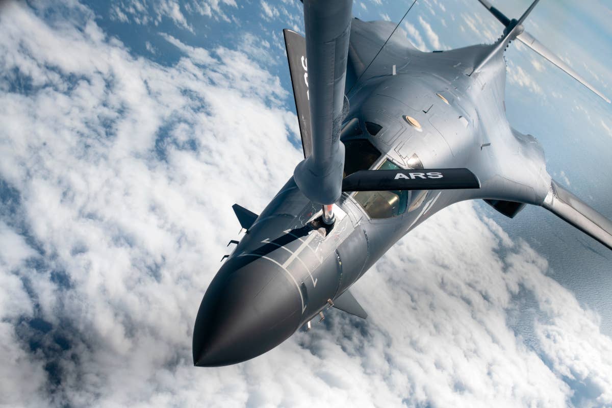 A B-1B bomber from the 37th Bomb Squadron links up with a KC-135 aerial refueling tanker over the Pacific Ocean during a sortie in November 2022. <em>USAF</em>
