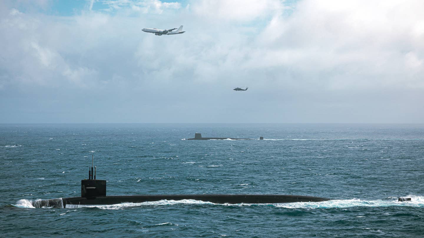 The U.S. Navy's <em>Ohio</em> class ballistic missile submarine USS <em>Tennessee</em>, in the foreground, sails together with one of its British counterparts, an unidentified Royal Navy <em>Vanguard</em> class SSBN, in December 2022. <em>USN</em>