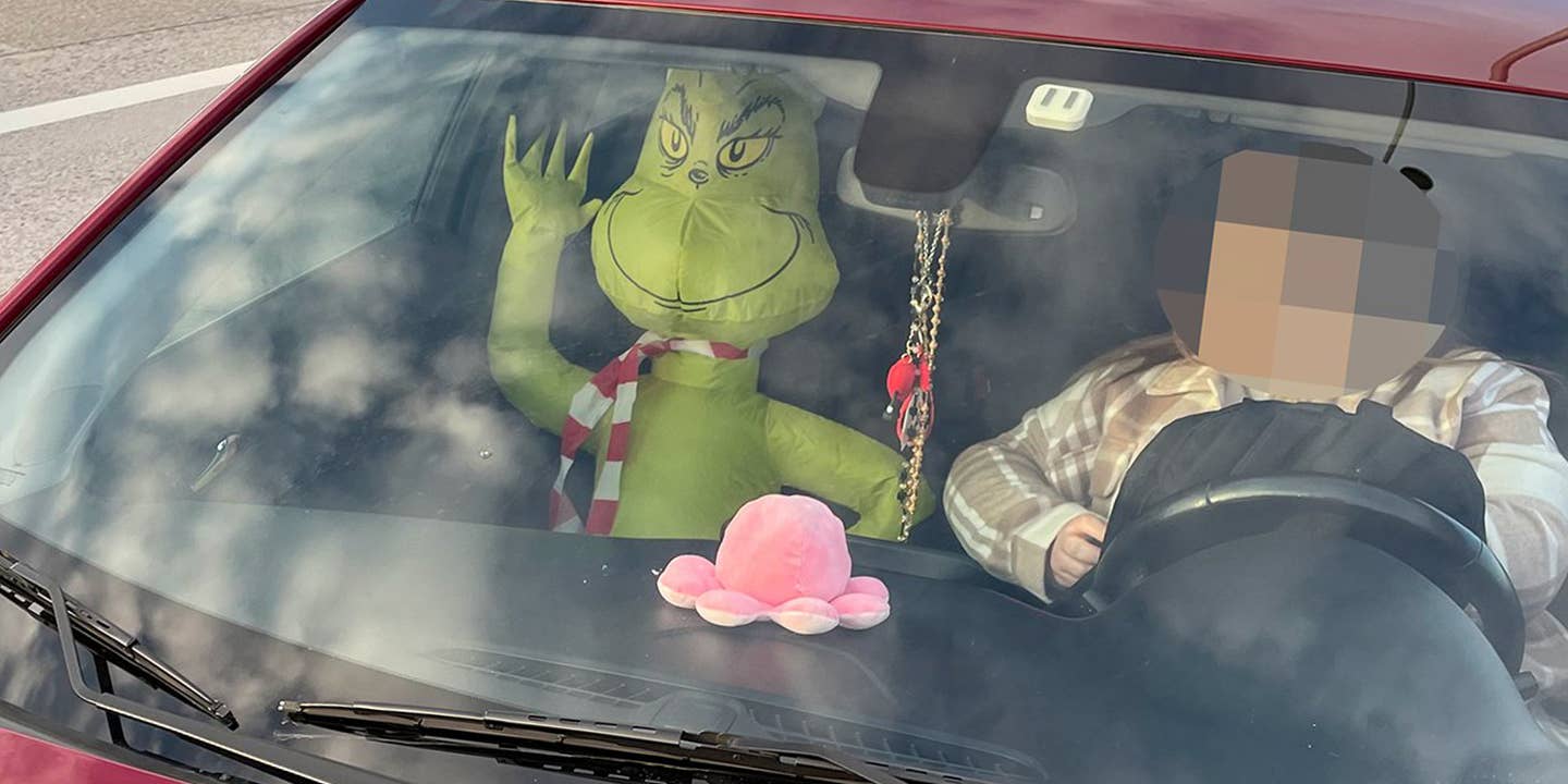 A Reminder That an Inflatable Grinch Doesn’t Count as a Real Passenger for the HOV Lane