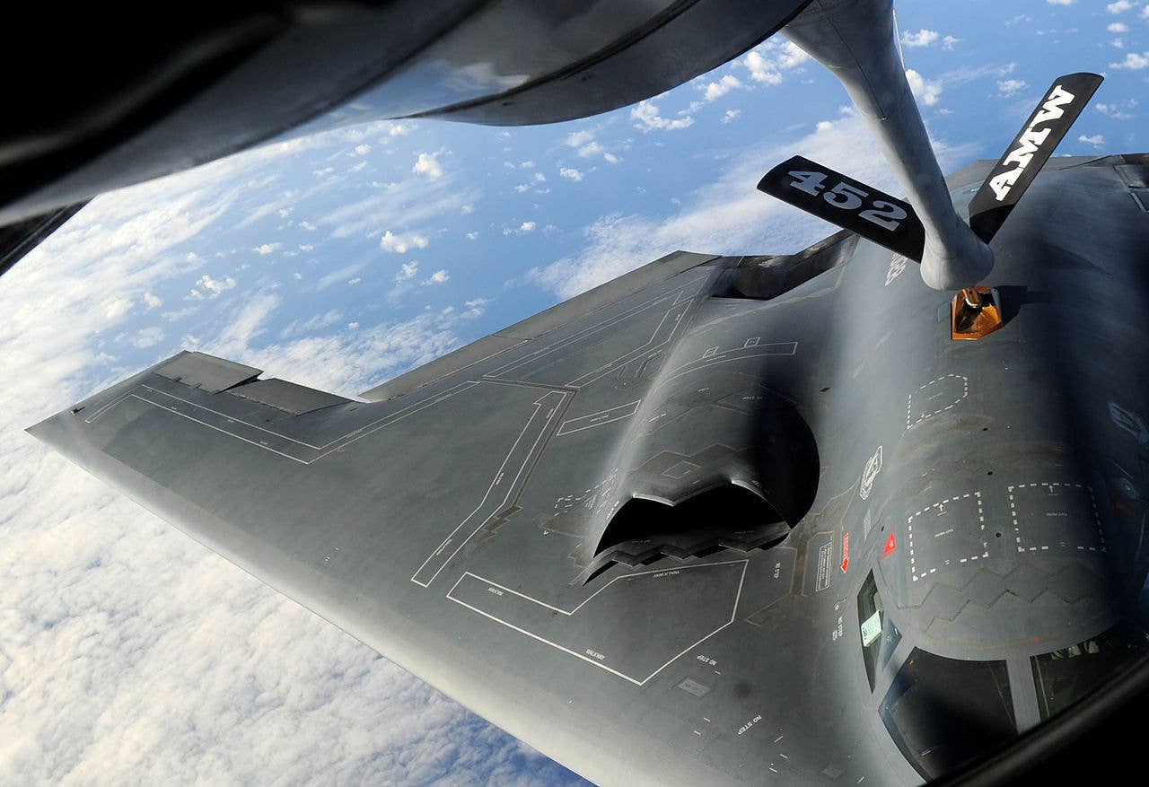The B-2 refueling, clearly showing its inlet design that still has a splitter to separate boundary-layer air and sits above the fuselage mold-line. (USAF)