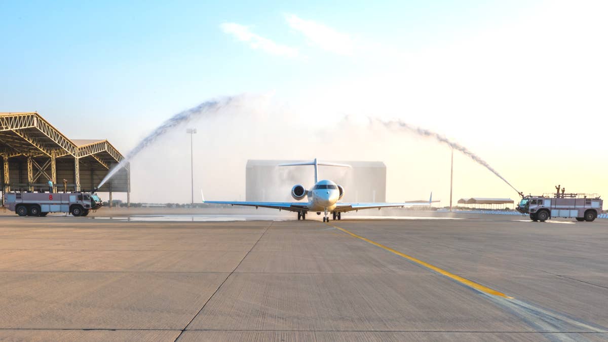 21-9045 receives a water salute after arriving at Prince Sultan Air Base. <em>USAF</em>