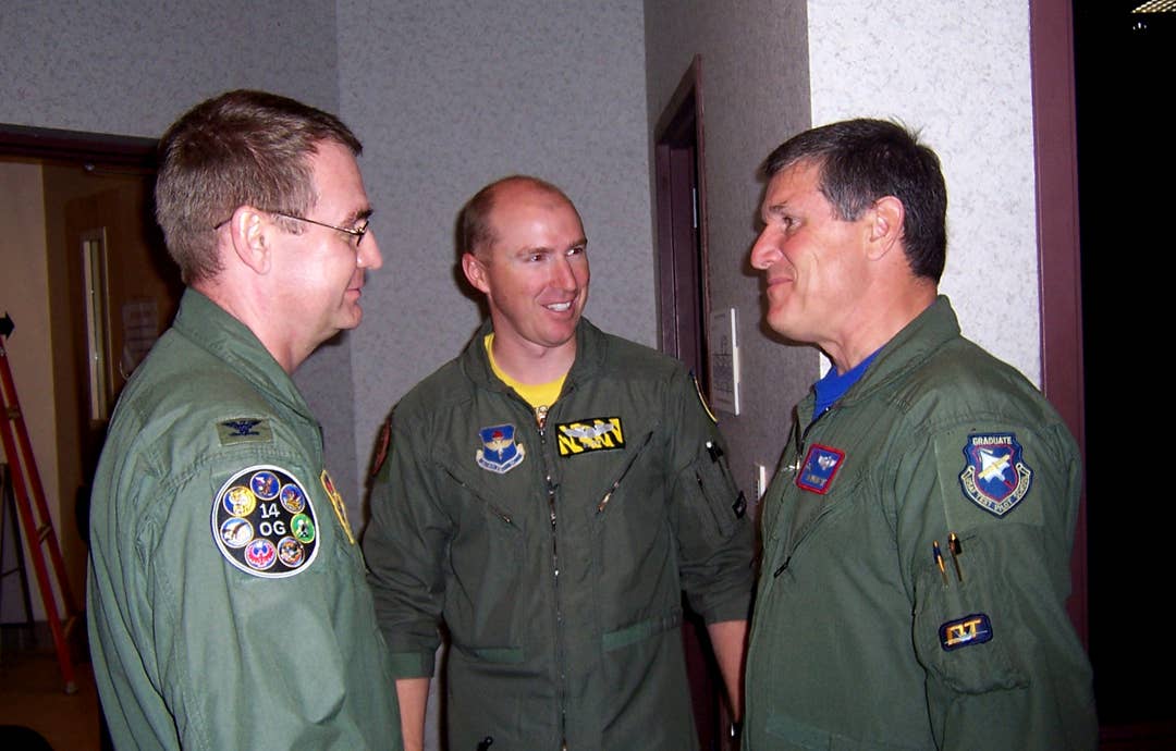 On the right, James Brown III, then a Lockheed Martin test pilot, is thanked after giving an F-22 presentation to instructors and student pilots at Columbus Air Force Base, Mississippi. <em>U.S. Air Force</em>