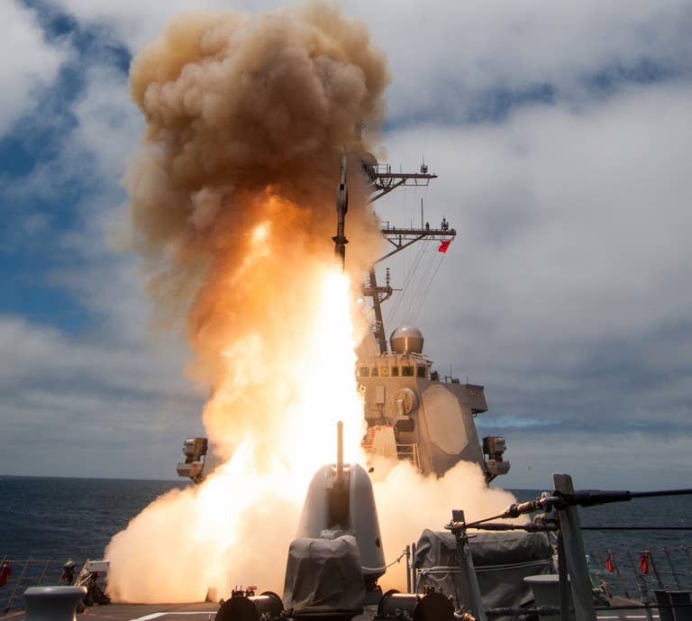 The <em>Arleigh-Burke</em> class guided-missile destroyer USS <em>John Paul Jones</em> (DDG 53) launches an SM-6 missile during a live-fire test of the ship’s Aegis Weapons System in 2014. <em>Photo: U.S. Navy</em>