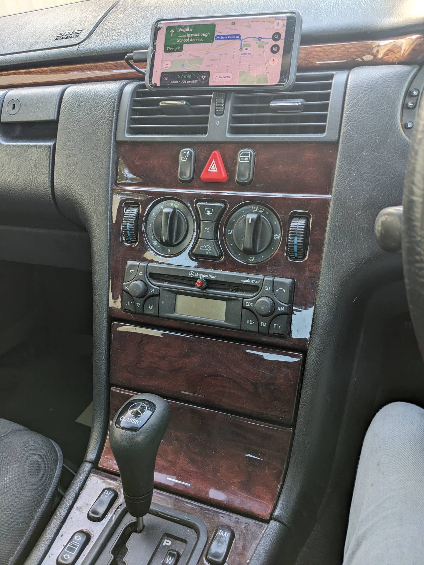 I'd contemplated installing the phone in the lower dash cubby, but figured looking down while driving wouldn't be great for a navigation screen. <em>Lewin Day</em>