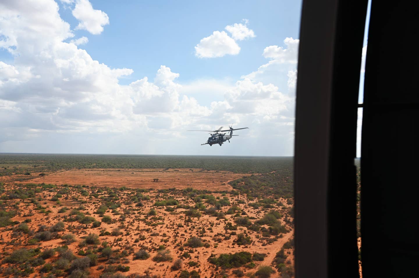 An HH-60W combat rescue helicopter follows behind its wingman in support of a CASEVAC exercise in eastern Africa on Dec. 8, 2022. <em>Credit: U.S. Air Force photo by Tech. Sgt. Jayson Burns</em>
