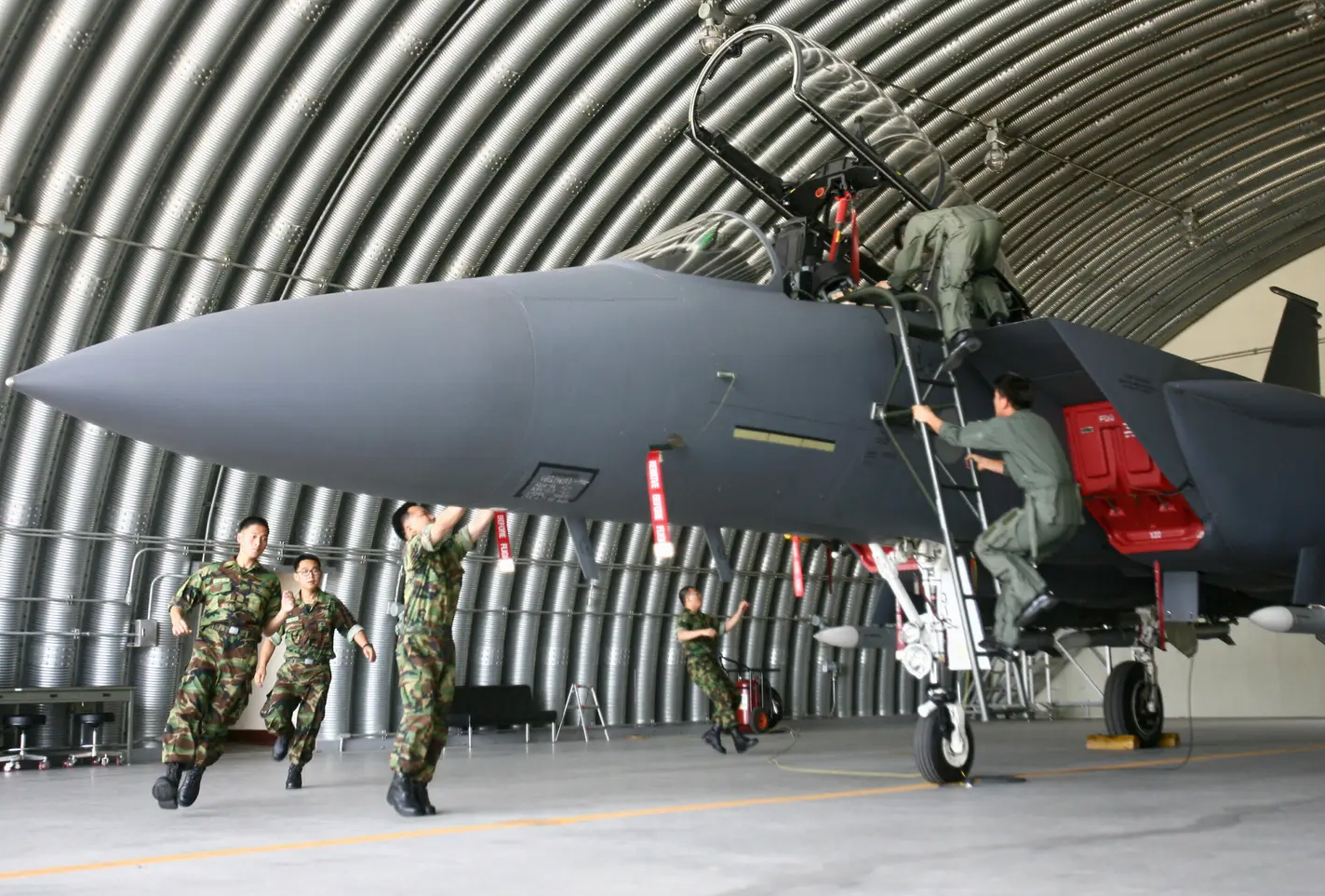 Republic of Korea Air Force pilots and maintainers race to launch an F-15K Slam Eagle fighter jet from a shelter at an airbase in the southern city of Daegu.&nbsp;<em>WON DAI-YEON/AFP via Getty Images</em>