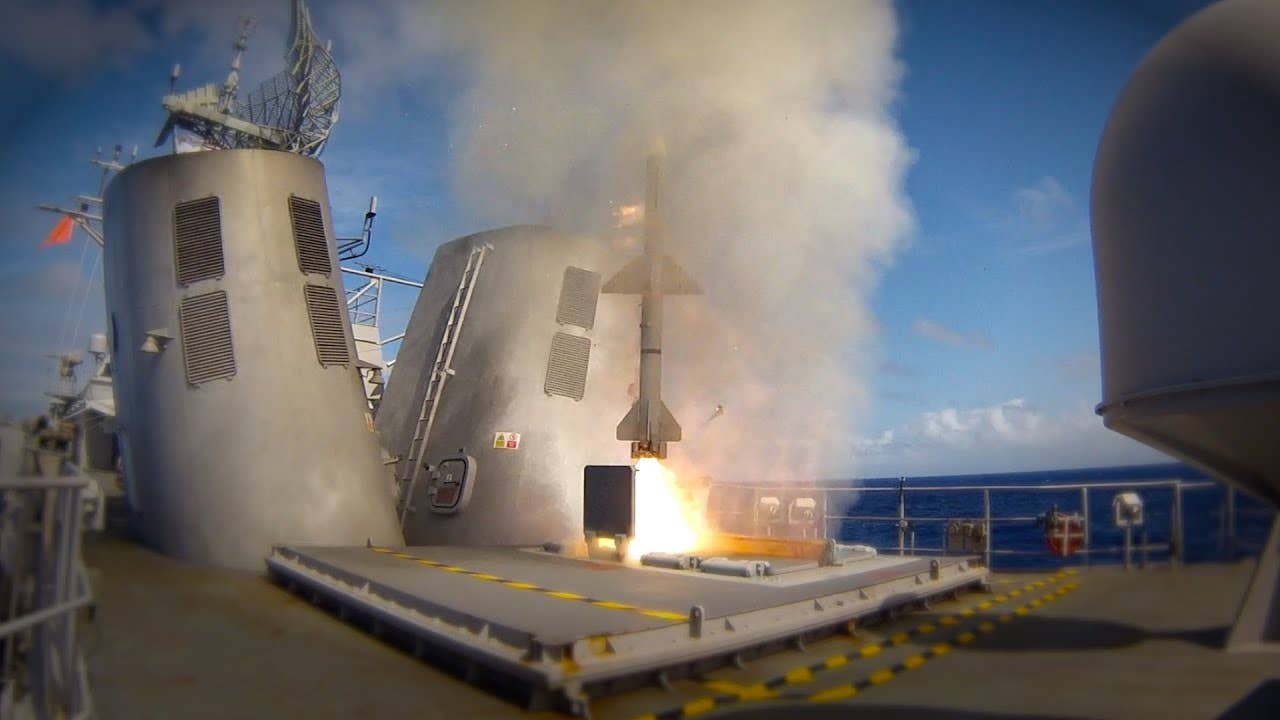 A vertical-launch RIM-7 being fired from a Royal New Zealand Navy frigate. This is a somewhat rare configuration. <em>RNZN</em>