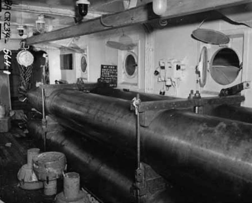 The ship's torpedo workshop. The overhead rail was used to move torpedoes in and out of the workshop. <em>U.S. Navy photo</em>