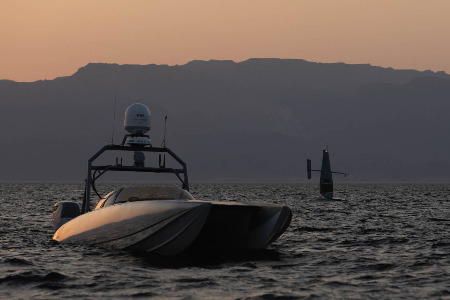 Two unmanned surface vessels, a Devil Ray T-38 and a Saildrone Explorer, operate in the Gulf of Aqaba, Sept. 10, during Eager Lion 2022. <em>Credit: U.S. Navy</em>