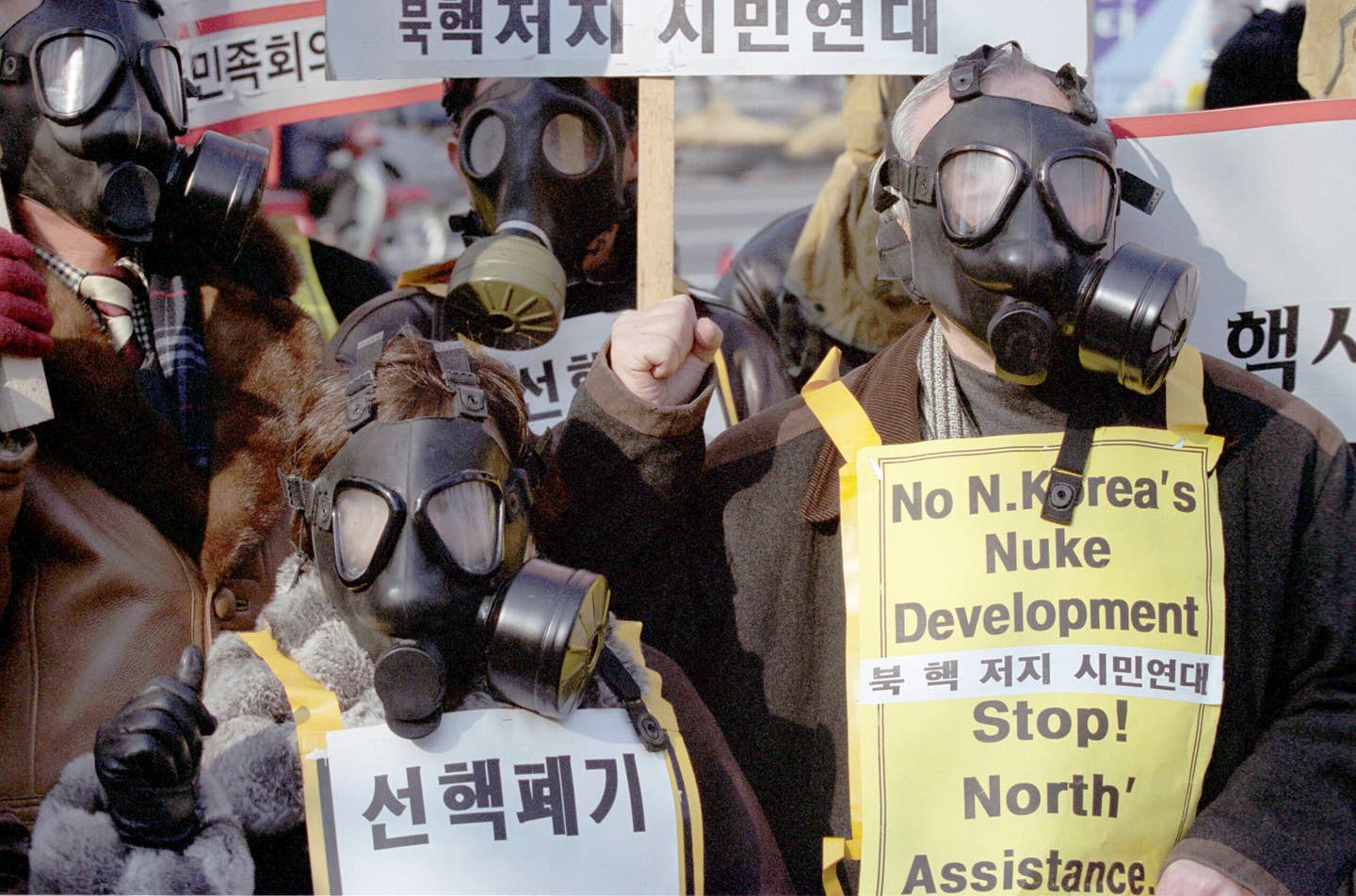 South Korean protesters during a rally in Seoul, January 2003. The protestors were demanding that North Korea abandon its nuclear weapons development program and also criticized the North Korean withdrawal from the Nuclear Nonproliferation Treaty (NPT). <em>Photo by Seung-il Ryu/NurPhoto via Getty Images</em>