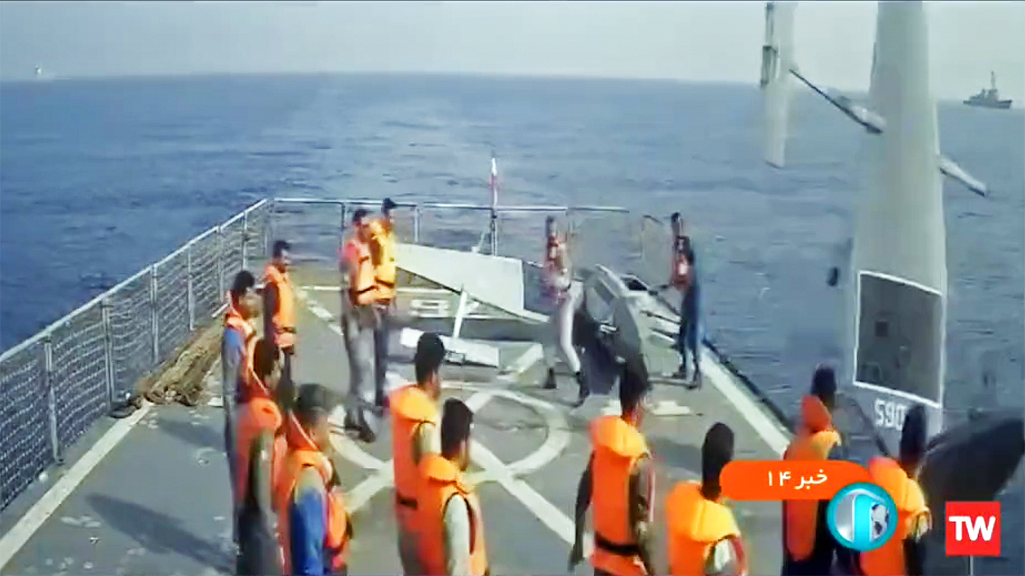 Screenshot from an Iranian state TV news broadcast showing Iran's Islamic Revolutionary Guard Corps Navy relinquishing the captured Saildrone USVs back to the Navy.<em> Credit: Iranian state TV</em>