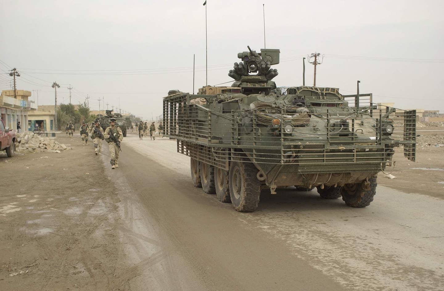 Soldiers of Battle Company, 5th Battalion - 20 Infantry, 3rd Brigade, 2nd Infantry Division (Stryker Brigade Combat Team) conduct route reconnaissance, a presence patrol, a civilian assessment, and combat operations contributing to the stability of Samarra, Iraq, on December 15, 2003. The 3rd Brigade, 2nd Infantry Division (Stryker Brigade Combat Team) is under the operational control of the 4th Infantry Division. (U.S. Army photo by Spc. Clinton Tarzia, Released)