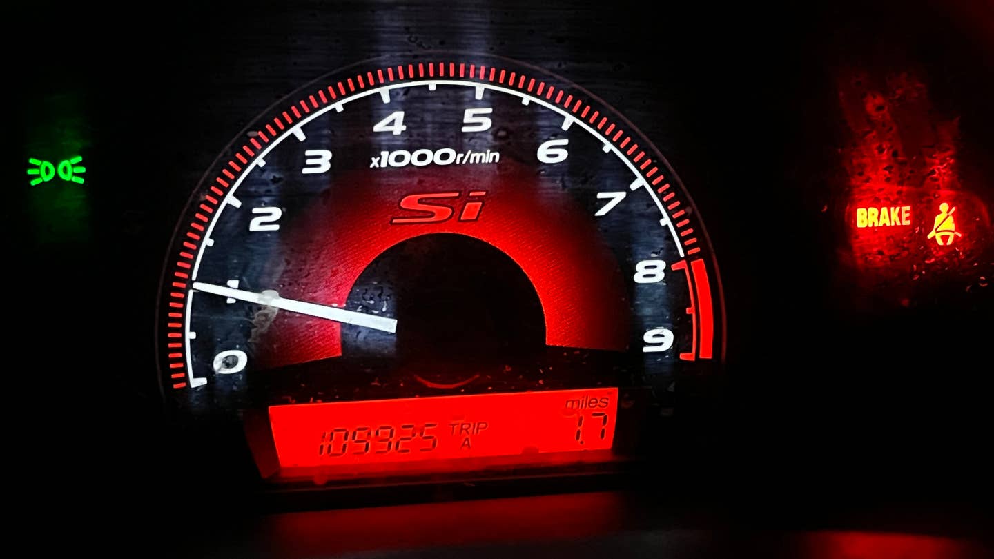 Even though the lens is scratched up (I've got a new one ready to go in) the tachometer and gauge cluster layout in general is one of the eighth-gen Civic's coolest features. <em>Andrew P. Collins</em>