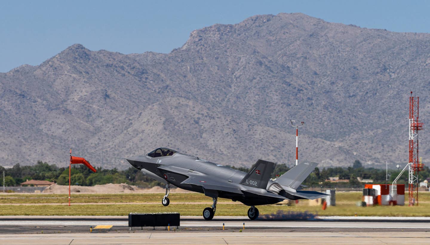 A Royal Danish Air Force F-35A assigned to the 308th Fighter Squadron lands at Luke Air Force Base, Arizona, on April 13, 2021. <em>U.S. Air Force photo by Airman 1st Class Dominic Tyler</em>