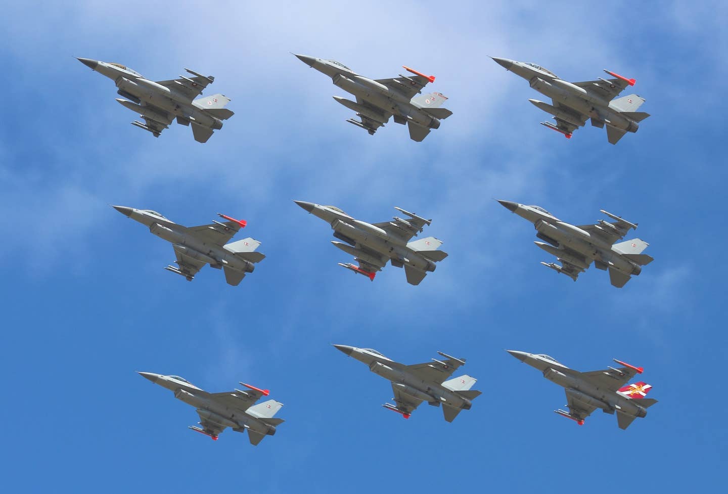 A nine-ship formation of Royal Danish Air Force F-16s from Skrydstrup, in 2014. <em>Slaunger/Wikimedia Commons</em>