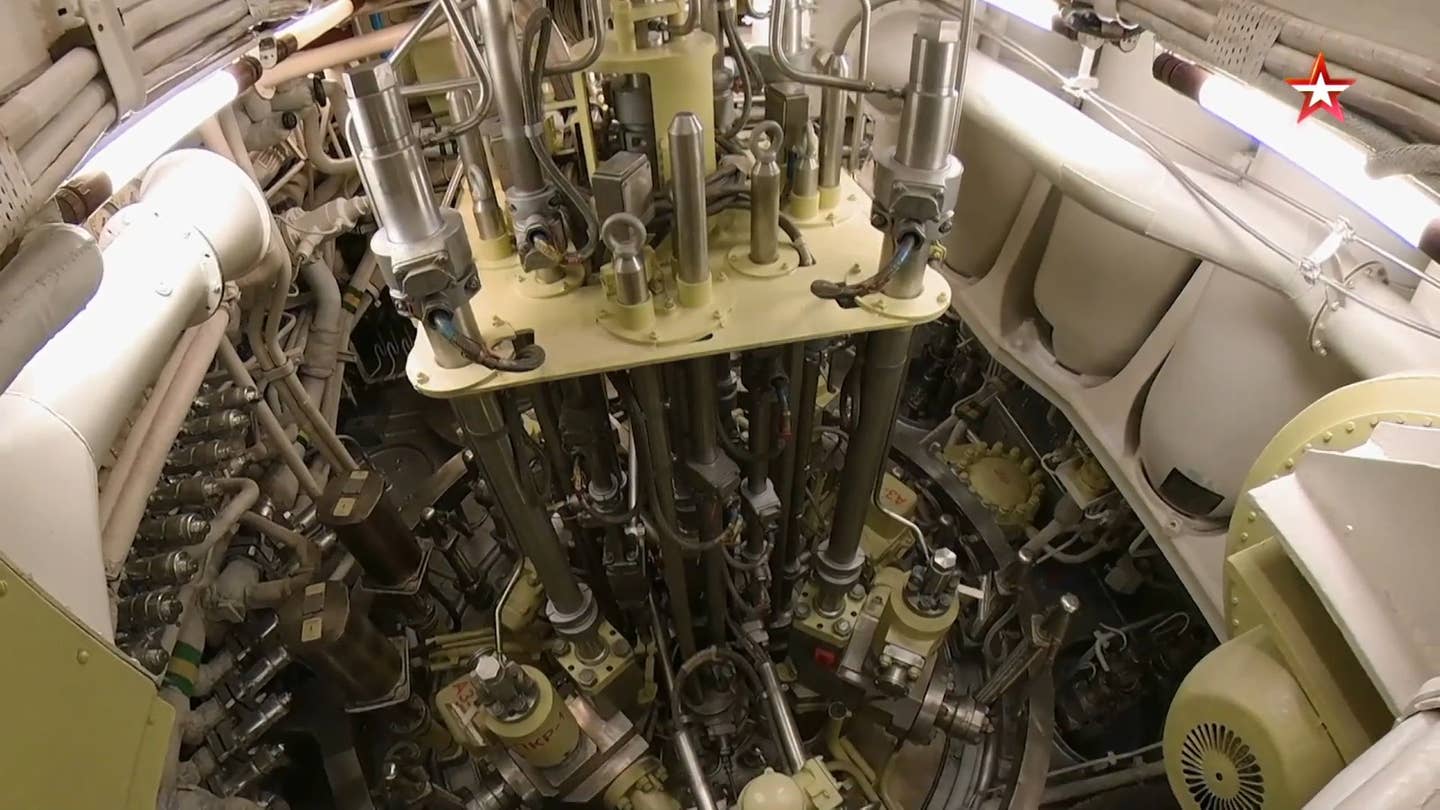 A view of the top of VM-4SG reactor onboard <em>Tula</em> showing the control rods and other components. <em>TV Zvezda capture</em>