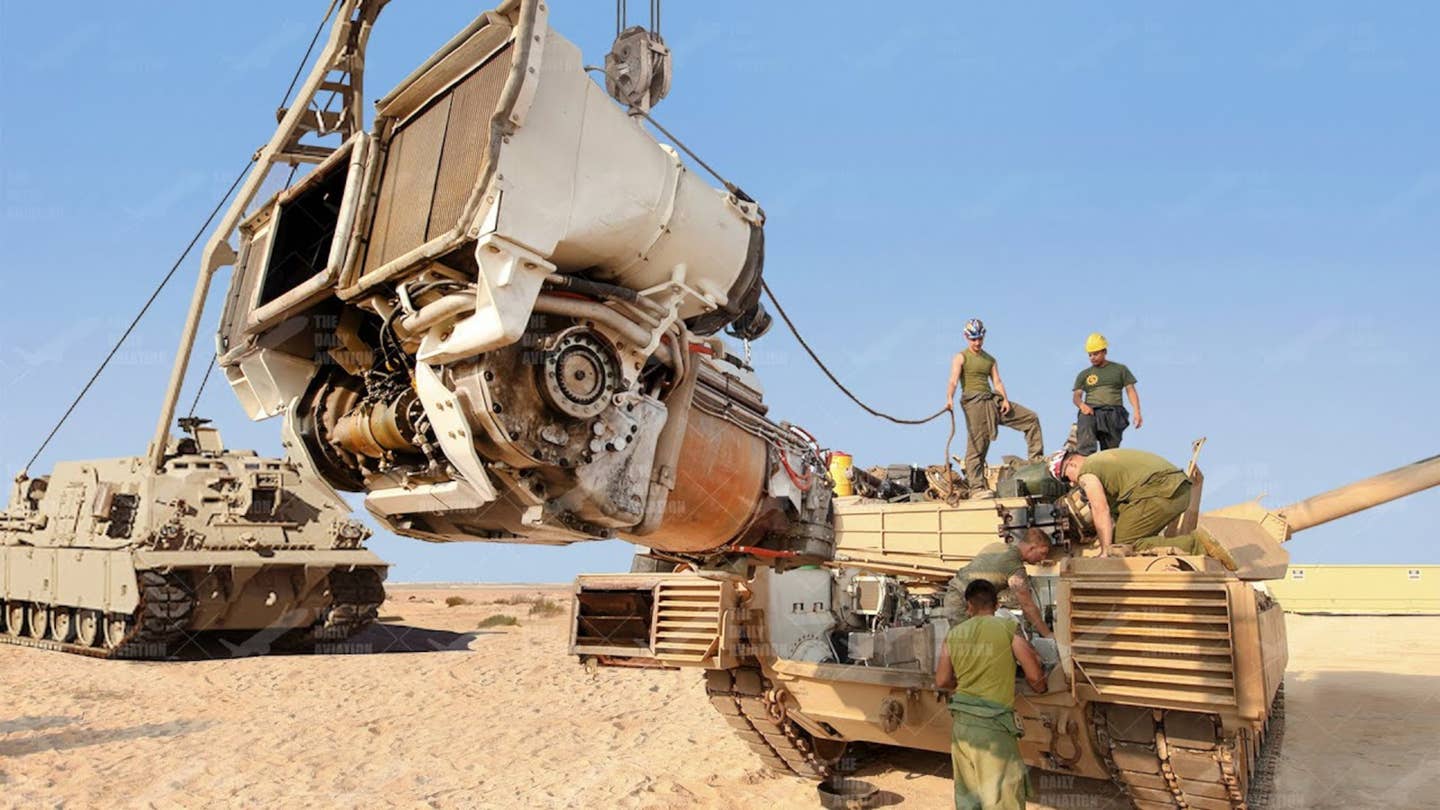 An M1 Abrams' Full-Up Power Pack (FUPP), which includes the Honeywell AGT1500 turbine engine, Allison X1100-3B transmission, and other components in a singular integrated propulsion unit, is seen here removed from the tank. <em>U.S. Army</em>