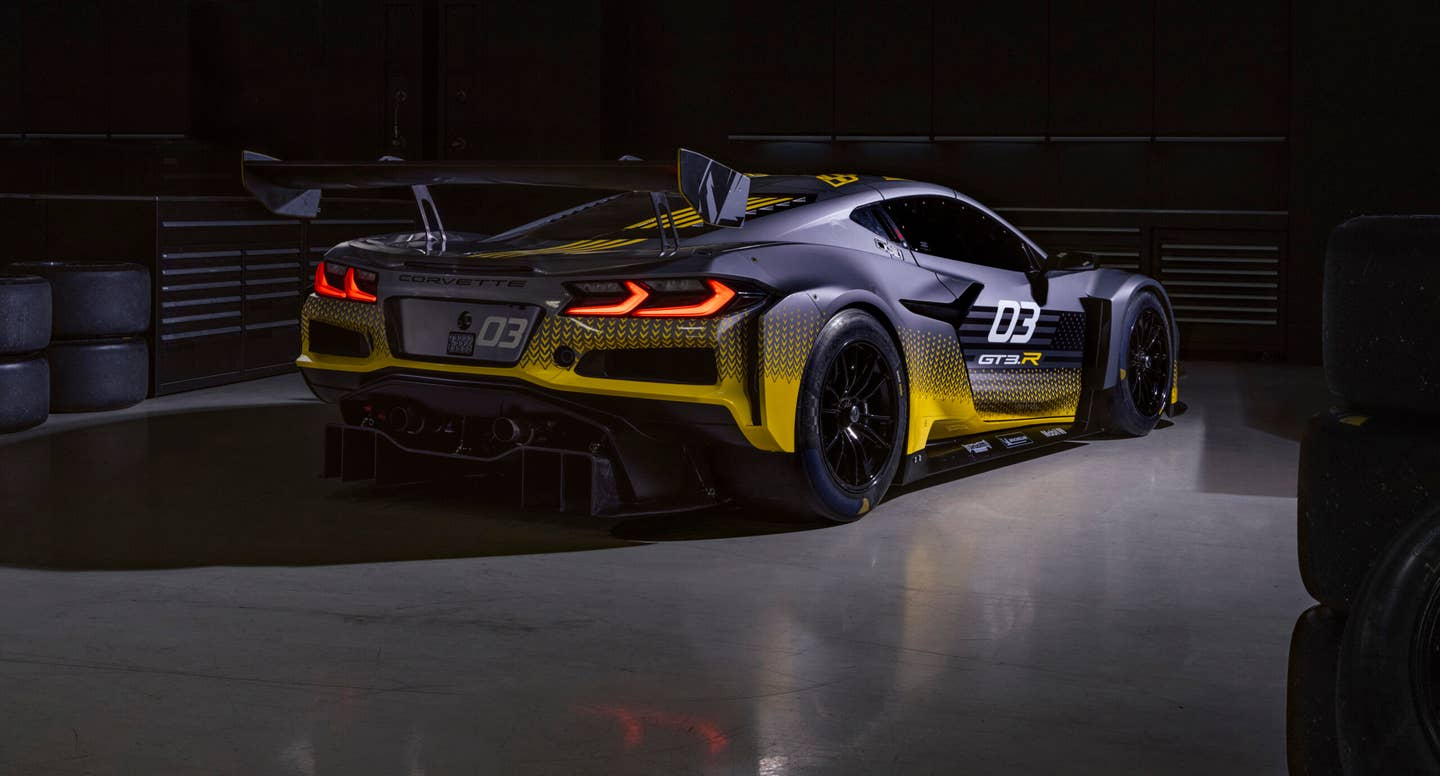 Rear 3/4 view of 2024 Chevrolet Corvette Z06 GT3.R parked in a race car garage. Pre-production model shown. Actual production model may vary. Model year 2024 Corvette Z06 GT3.R will be available later this year.