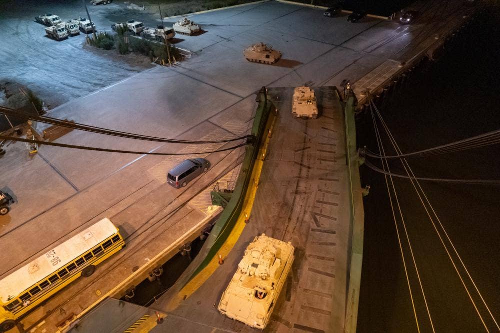 A convoy of Bradley Fighting Vehicles load onto the ARC Integrity at the Transportation Core Dock in North Charleston, South Carolina, Jan. 25 (U.S. Transportation Command photo by Oz Suguitan)