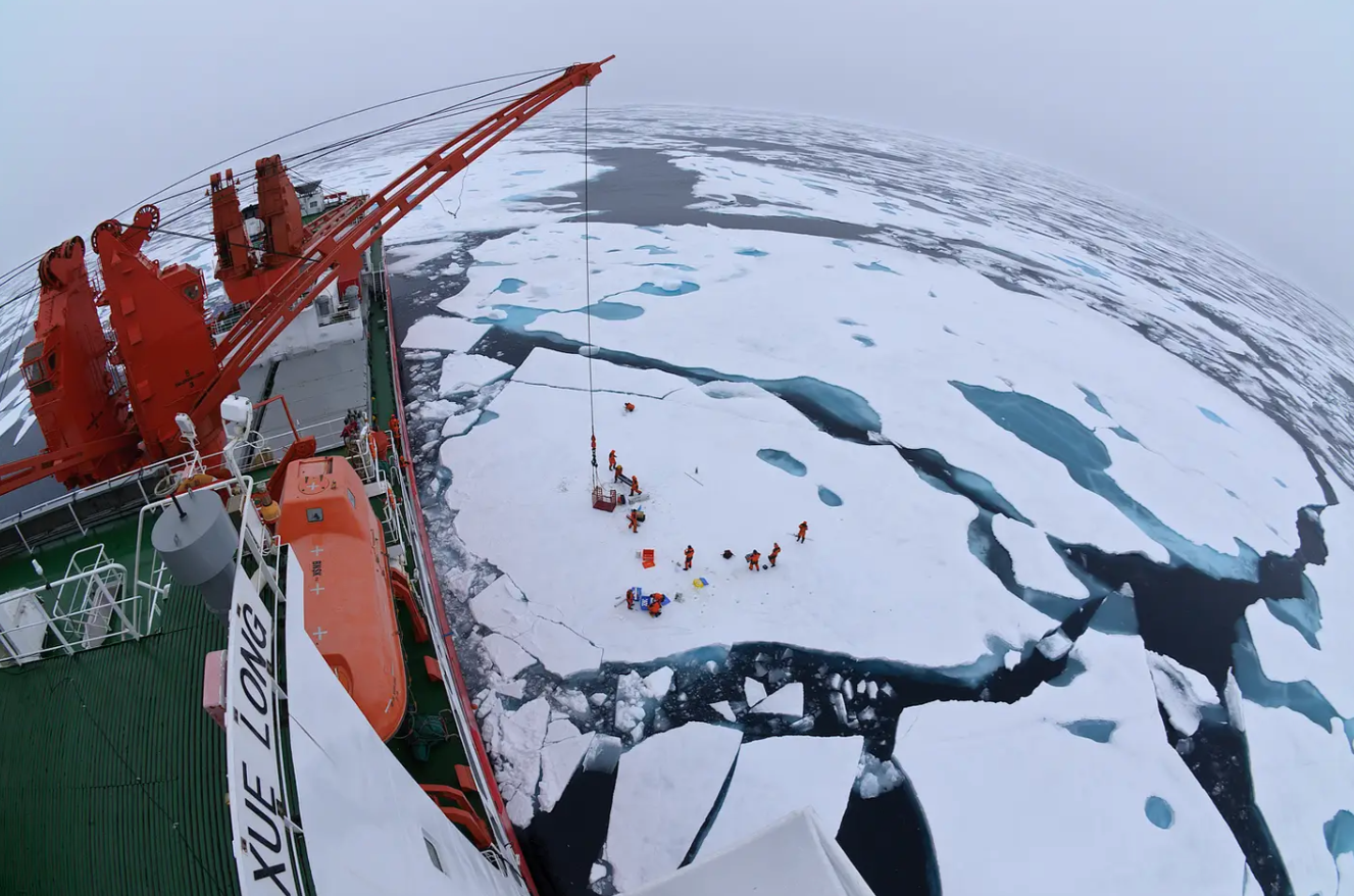 The Chinese icebreaker&nbsp;<em>Xue Long&nbsp;</em>lowers equipment to the Arctic ice.&nbsp;<em>Public domain</em>