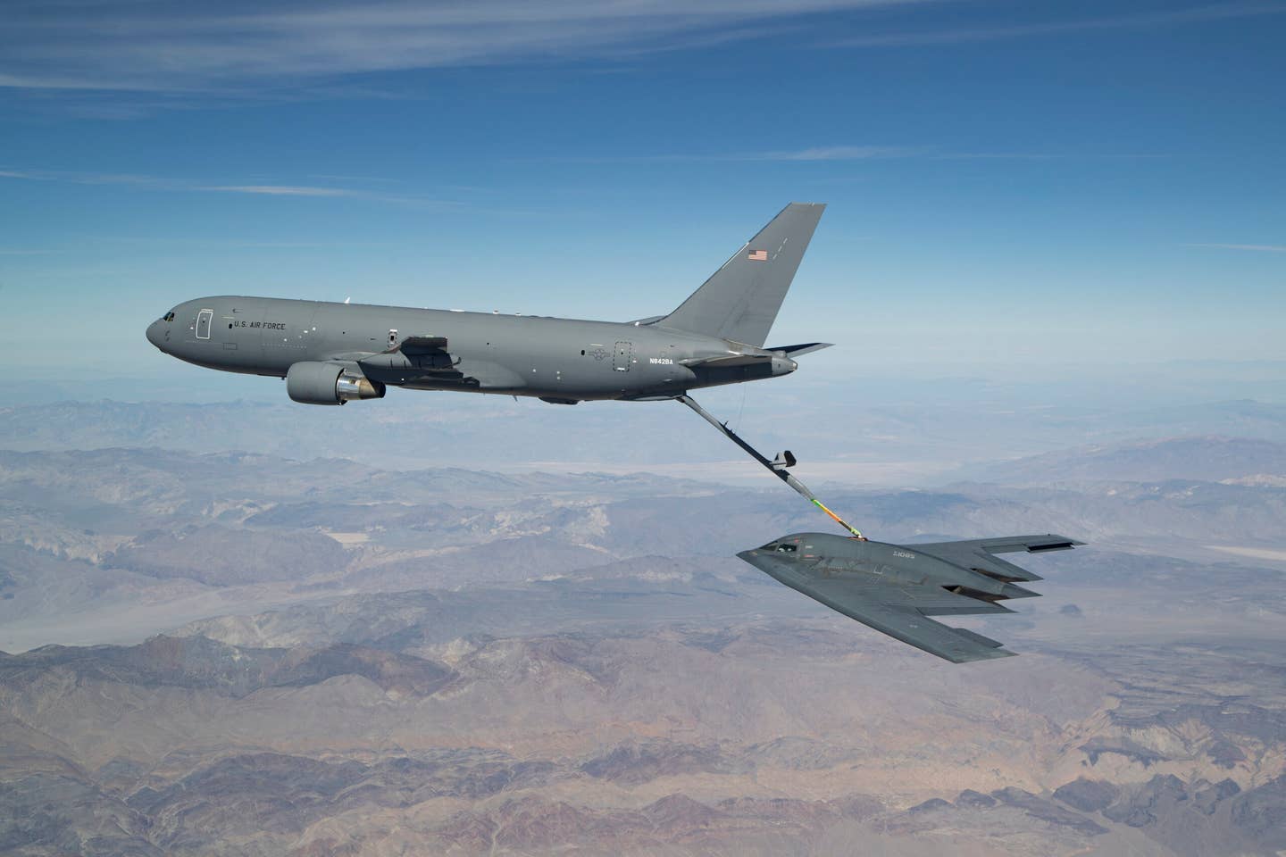 A B-2A Spirit stealth bomber links up with a KC-46A tanker during a test in 2019. <em>USAF</em>