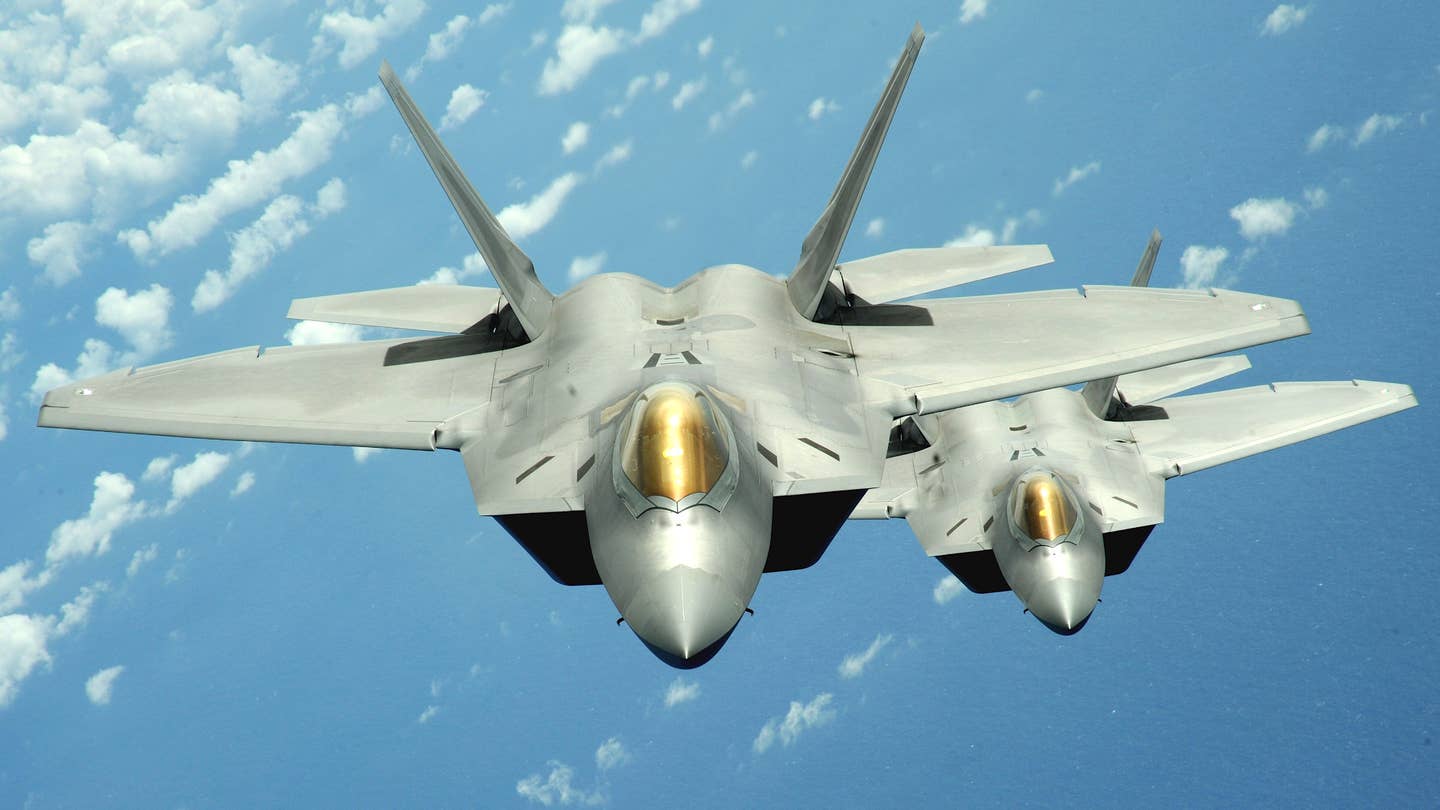 A pair of F-22 Raptor stealth fighters. <em>USAF</em>
