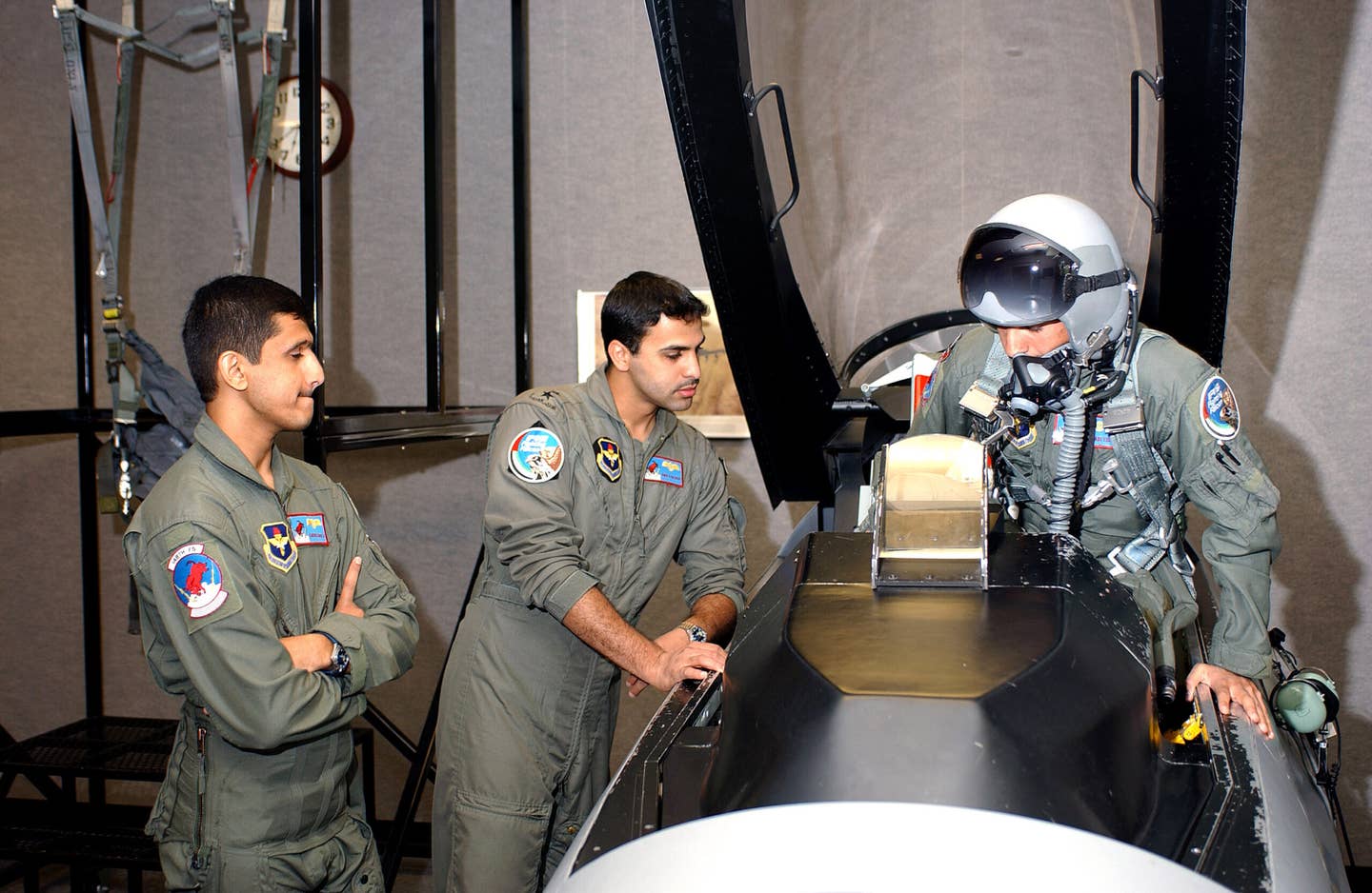 Three student pilots from the United Arab Emirates practice emergency egress procedures as part of their F-16 flight training with the 162nd Fighter Wing of the Arizona Air National Guard in Tucson, Arizona. <em>U.S. Air Force photo/Master Sgt. Dave Neve</em>