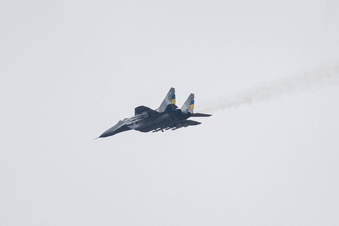 A Ukrainian Air Force MiG-29 flying over eastern Ukraine with a full air-to-air missile load-out, on January 1, 2023. <em>Photo by SAMEER AL-DOUMY/AFP via Getty Images</em>