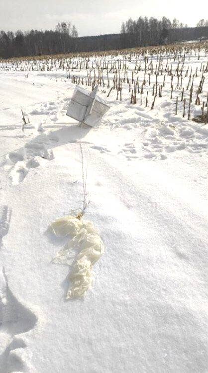 One of the balloons that was shot down over Kyiv airspace today. The remains of the balloon's envelope is visible in the foreground and what looks to be a radar reflector is seen behind connected via some kind of line. (Courtesy photo)