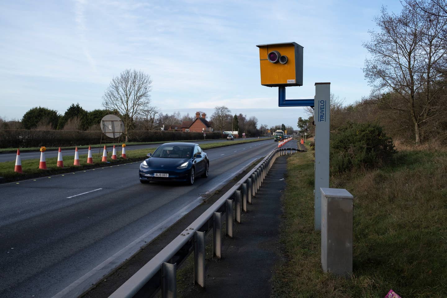 Cars passing a yellow speed camera on the A452 on 29th December 2021 in Berkswell, United Kingdom. A traffic enforcement camera is a camera which may be mounted beside or over a road or installed in an enforcement vehicle to detect traffic regulation violations, including speeding. (photo by Mike Kemp/In Pictures via Getty Images)