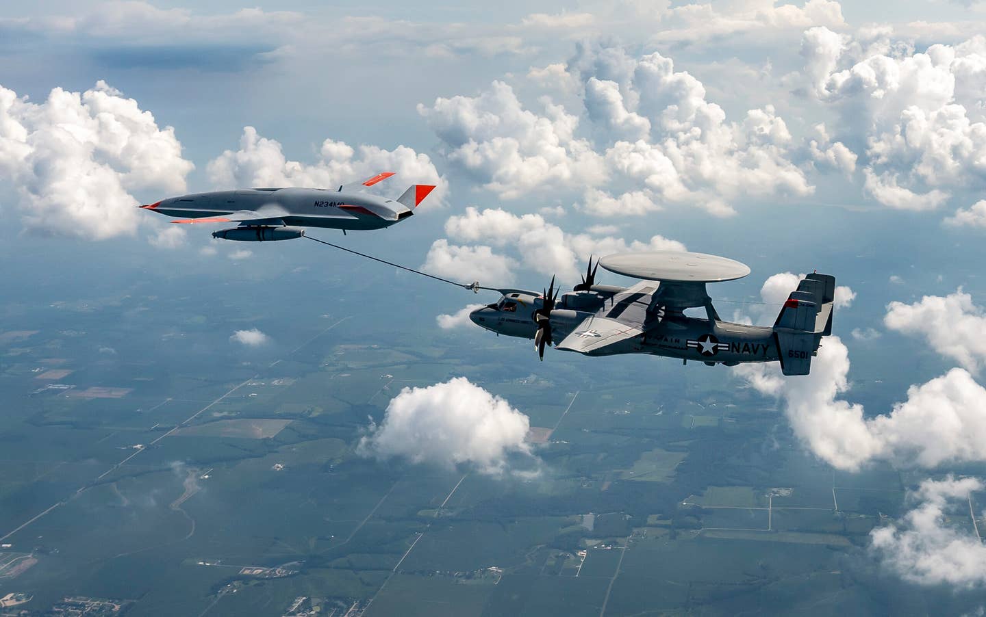 A U.S. Navy MQ-25 Stingray drone refuels an E-2D Advanced Hawkeye. <em>Boeing</em>