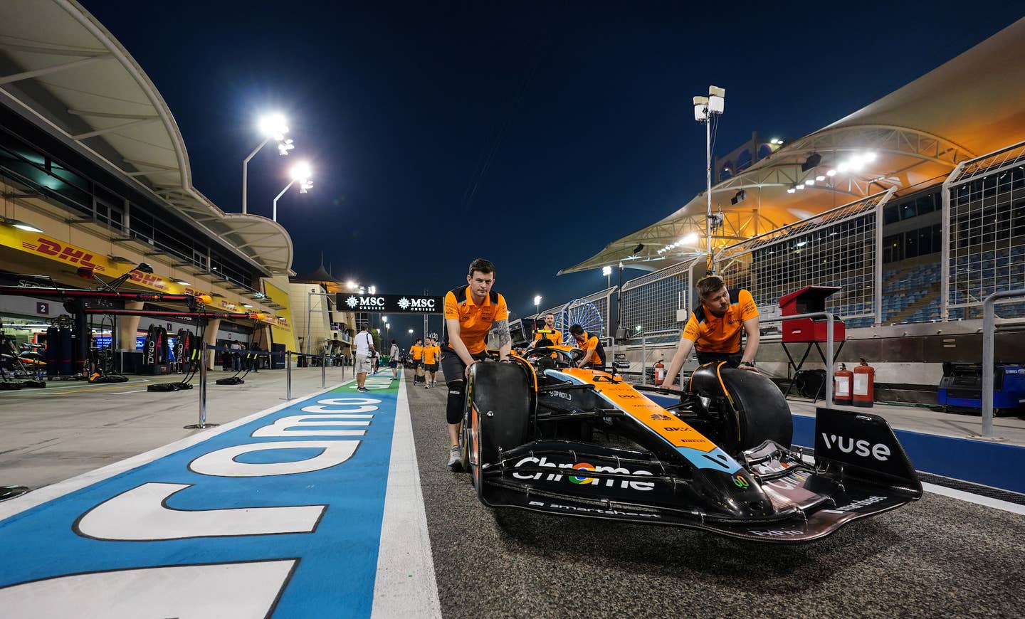 McLaren mechanics with Lando Norris' car during preview day of the Bahrain Grand Prix at the Bahrain International Circuit, Sakhir. Picture date: Thursday March 2, 2023. (Photo by David Davies/PA Images via Getty Images)