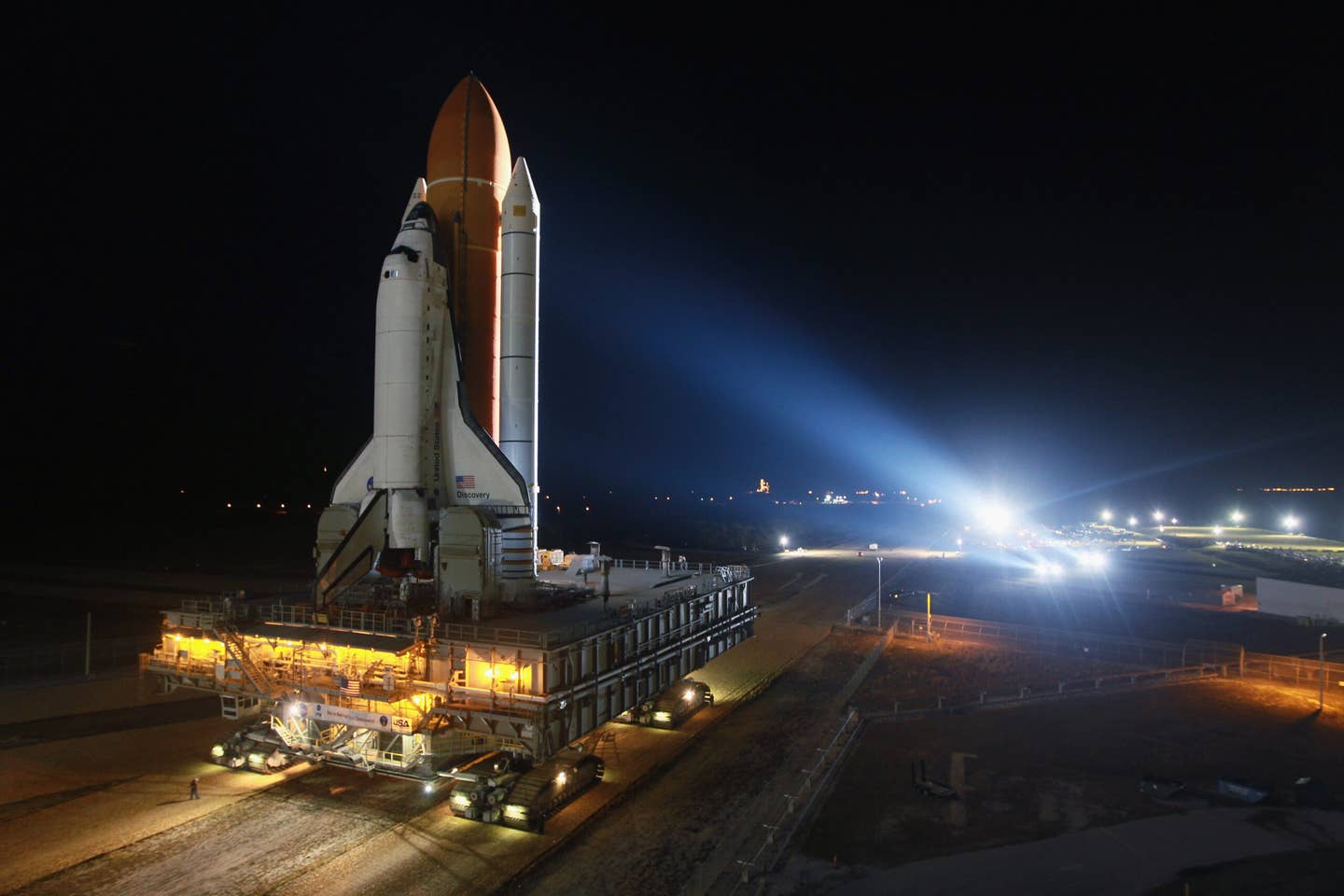 Space shuttle Discovery rolls to the launch pad after emerging from NASA's vehicle assembly building atop a crawler transporter at Kennedy Space Center in 2011. <em>Joe Raedle/Getty Images</em>