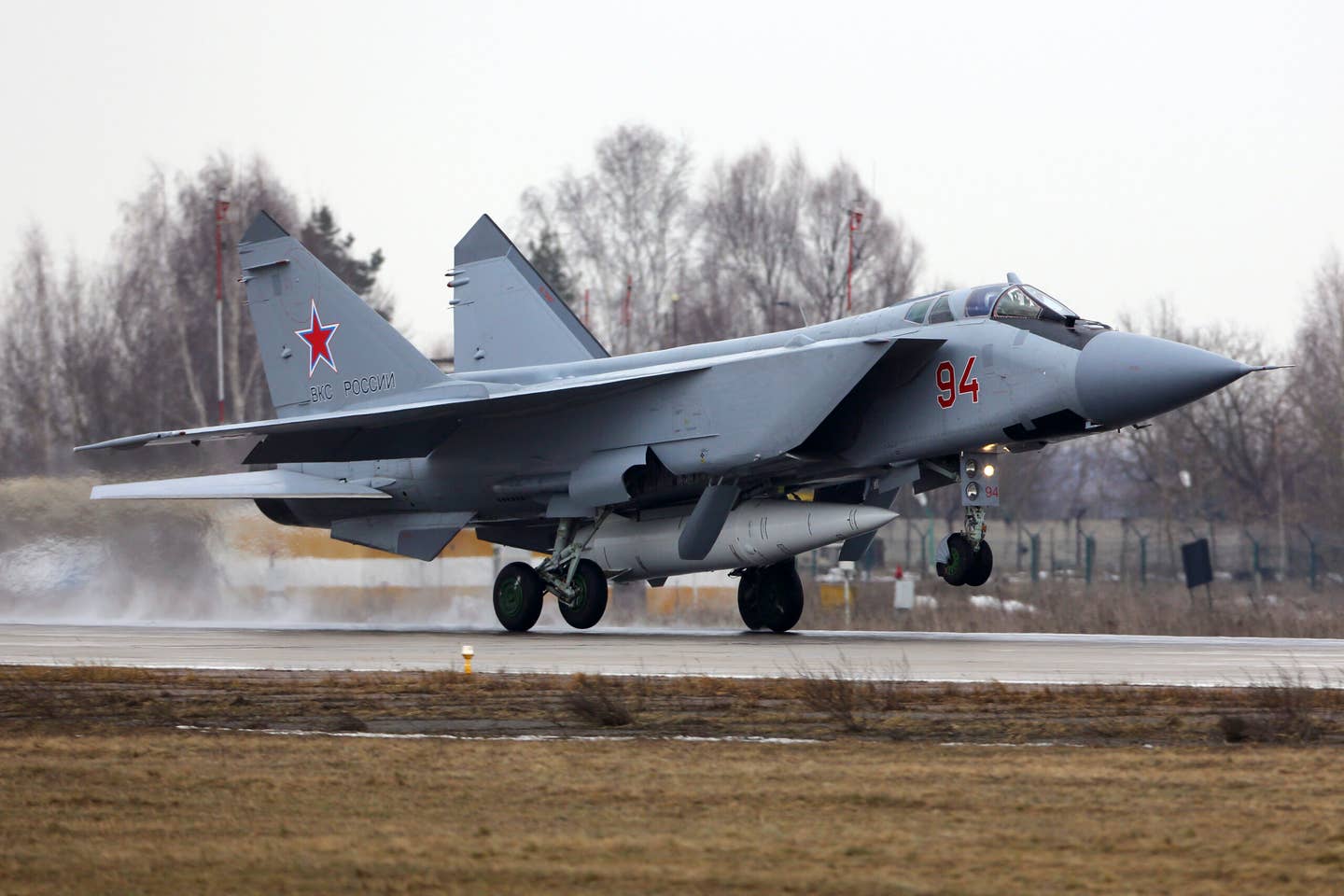 A MiG-31K of the Russian Aerospace Forces lands at Zhukovsky, Russia, with a Kinzhal missile below the fuselage. <em>Stock photo via Getty Images</em>