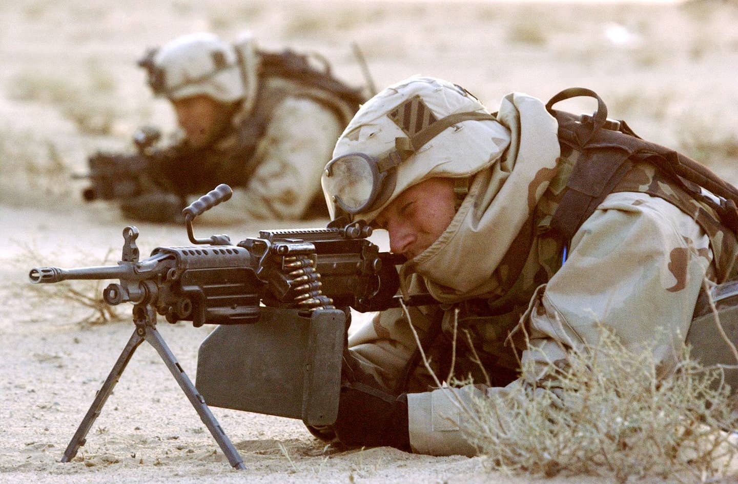 A platoon from the U.S. Army 3rd Division man a frontline position near the Iraqi city of Karbala, March 29, 2003, during the push northward toward Baghdad. <em>Photo by Scott Nelson/Getty Images</em>