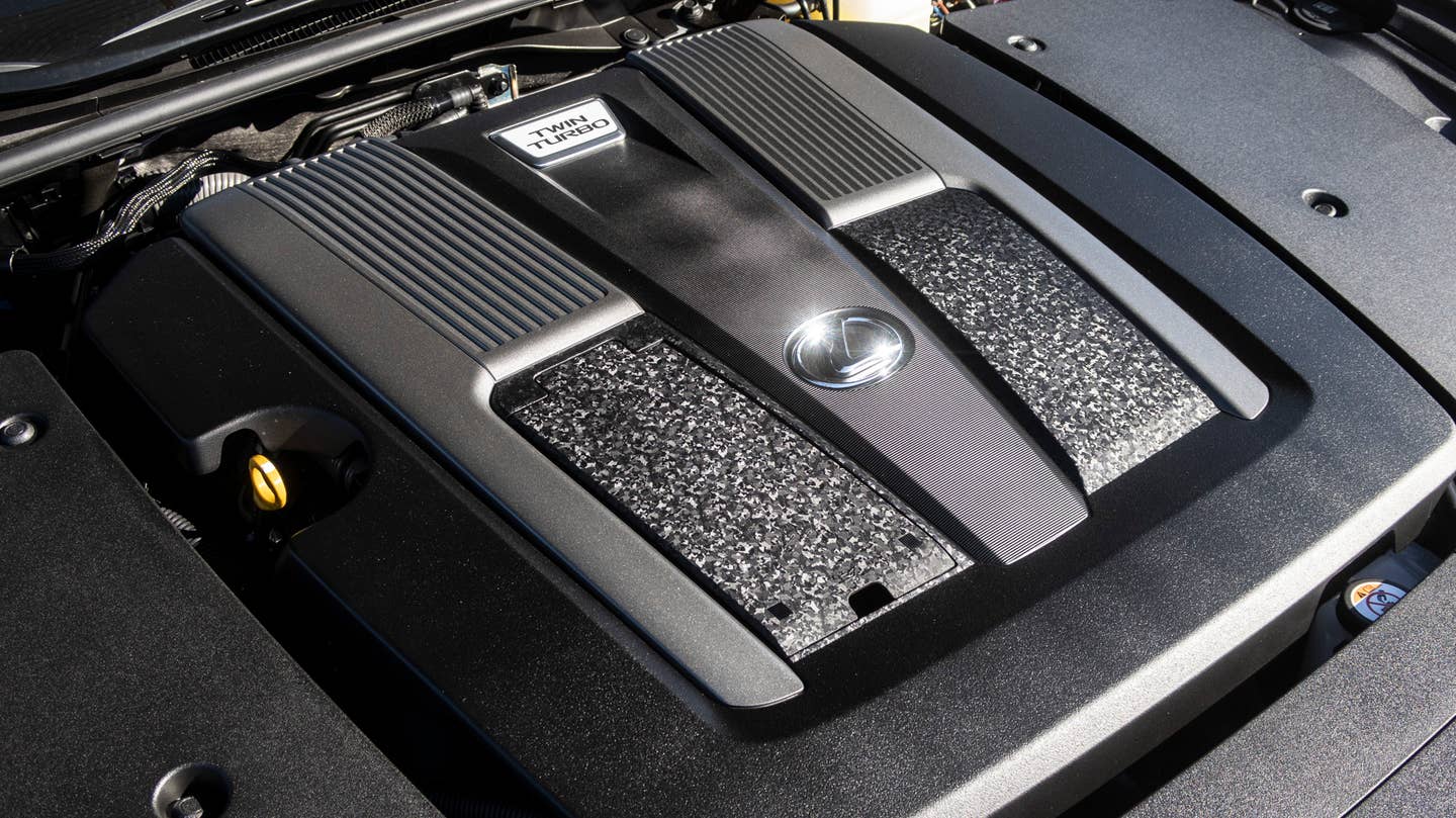 The LS's engine is completely covered, but at least the covering is a little artful. <em>Andrew P. Collins</em>